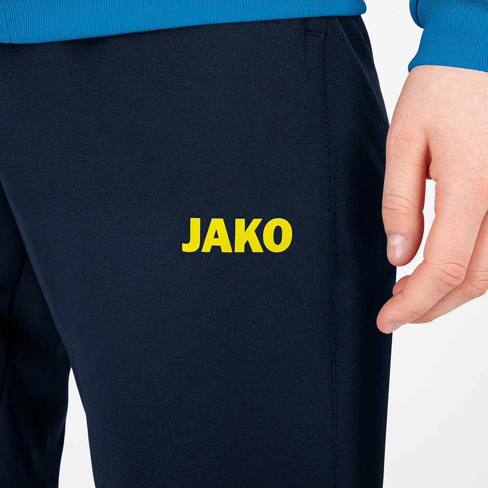 PANTALÓN POLIÉSTER JAKO CHALLENGE, MARINO-AMARILLO MUJER. 